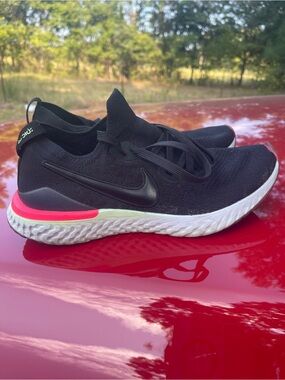 Nike Women's Epic React Flyknit Black Running Shoes with Pink and White Accents